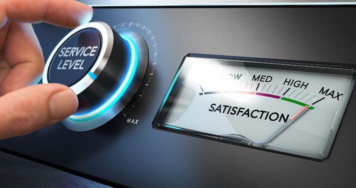 hand turning a service level knob up to the maximum with a dial where it is written the word satisfaction. concept image for illustration of key performance indicator, kpi or customer loyalty.