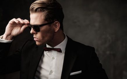 Handsome man in tuxedo with sunglasses