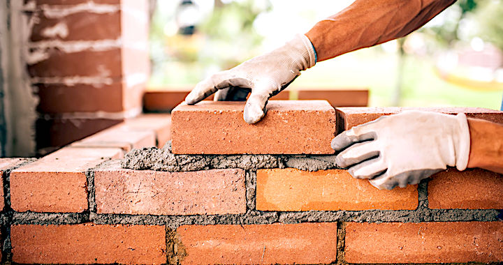 bricklayer laying bricks