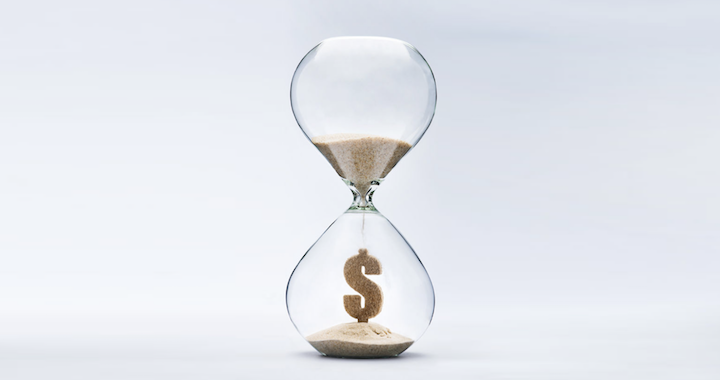 hourglass with sand in shape of dollar sign