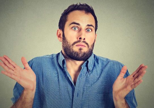 Man shrugging with a confused expression.