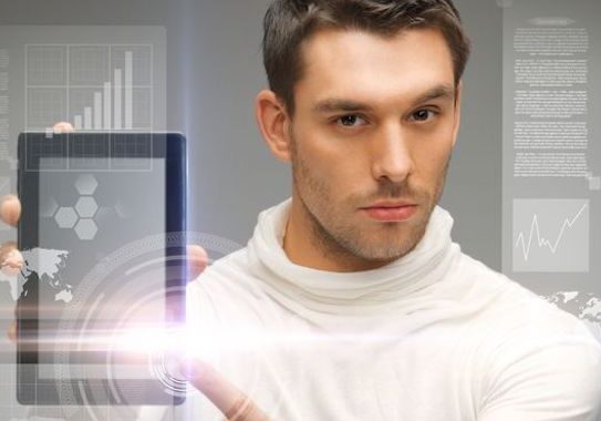 Man holding tablet with digital interface.
