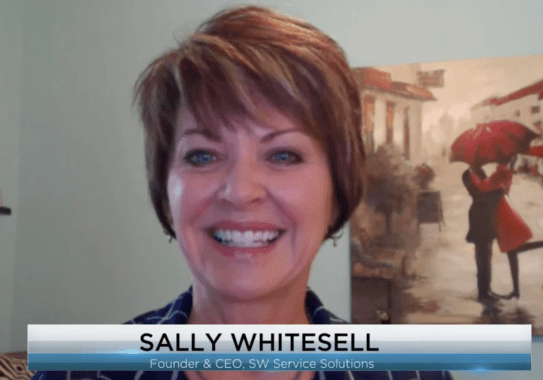 Smiling person in a virtual meeting.
