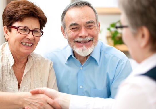 Elderly couple meeting with a professional.